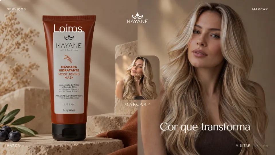 Hayane Hair & Experience home page: Hayane product, a model with long blonde hair and the line "Cor que transforma"